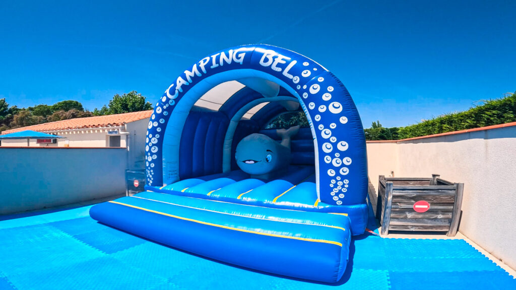 Bouncy castle inside Camping Bel pool area