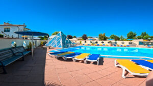 Sun loungers around Camping Bel pool