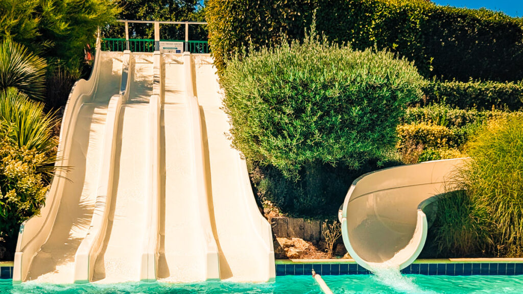 Waterslides in the pool area when staying with Eurocamp At Camping Homair La Grande Metairie
