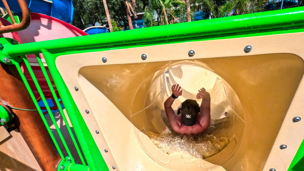 Mike going down the pirate ship waterslides on the play structure at camping cote d'argent
