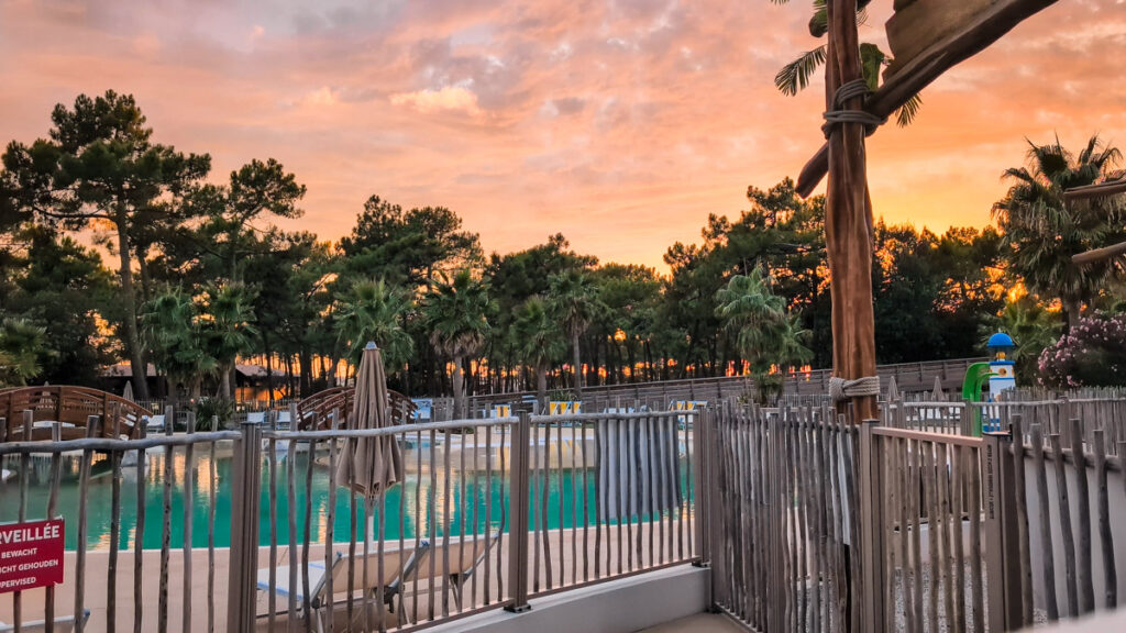 sunset over the pool area in the evening