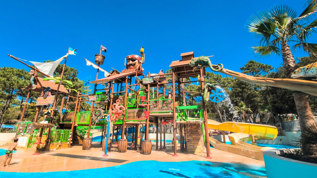 Wide angle view of the whole structure pirate playground waterslide area at camping cote d'argent