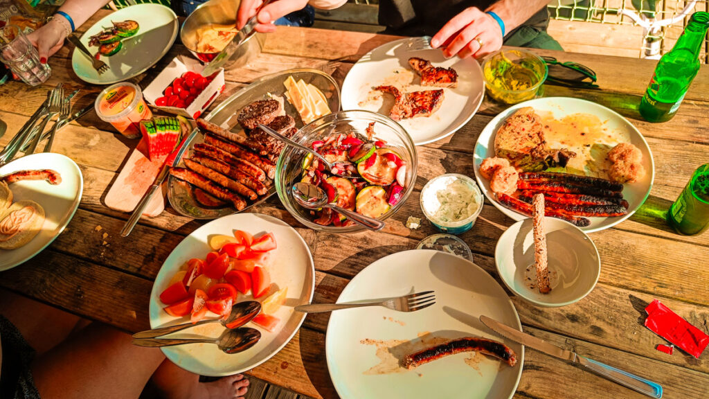 A big family lunch spread out on the decking of our Eurocamp mobile home