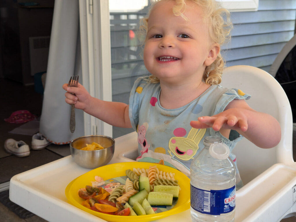 Our youngest tucking into a plate of pasta