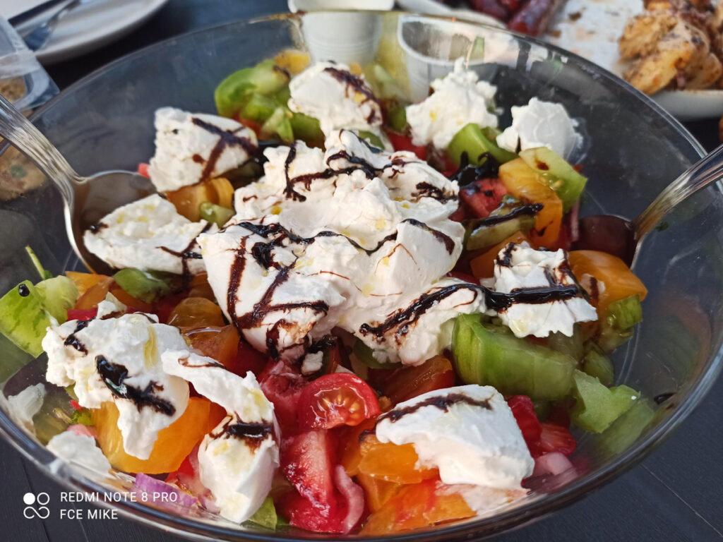 One of our holiday salads with leaves, cheese and tomatoes