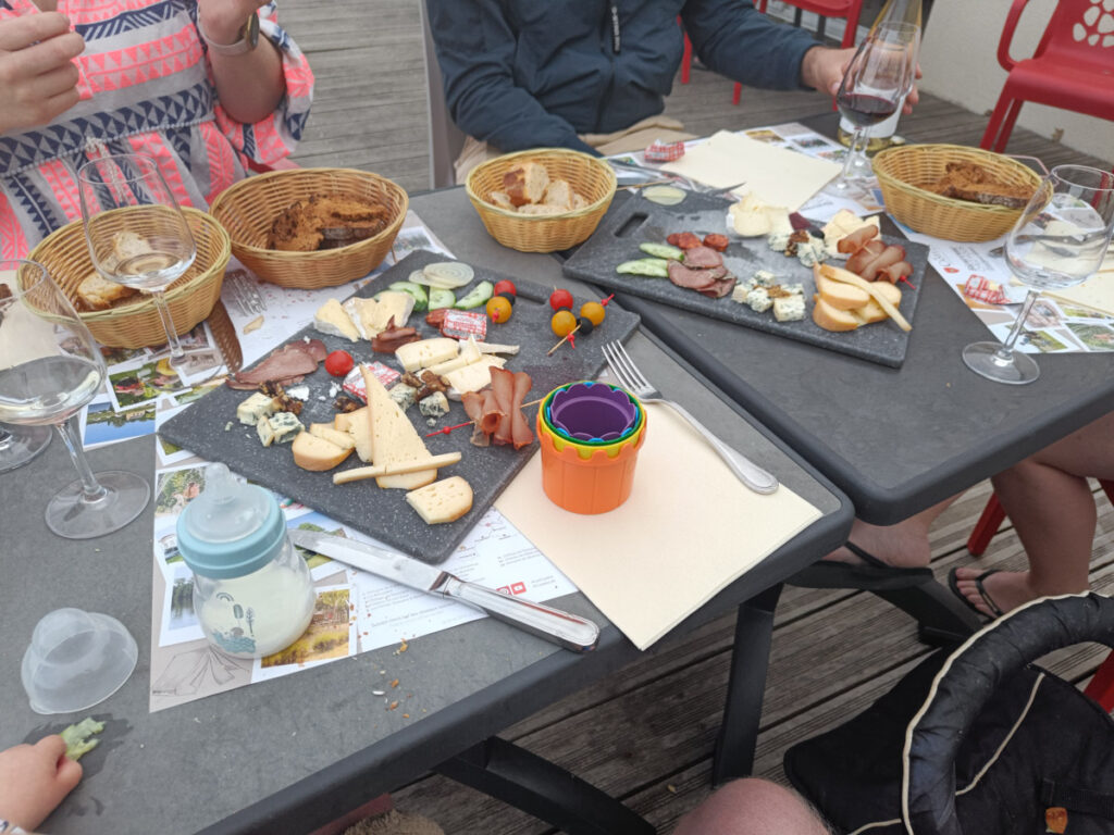 Cheese, cured meats and wine at a campsite food night